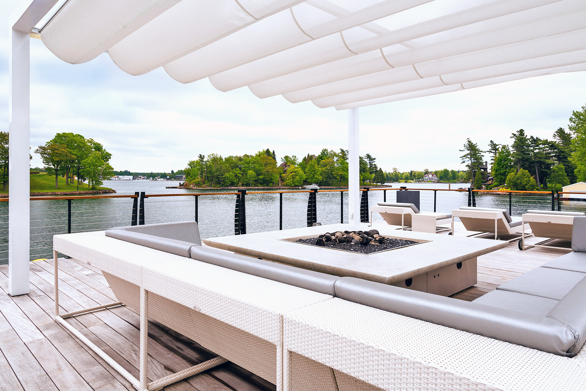 white retractable shade canopy on a boathouse